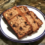 Hero image of moist banana bread with cottage cheese, sliced and styled for social sharing.