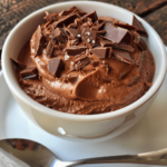 Large homemade portions of 3 ingredient chocolate mousse in casual bowls, taken on a phone camera by an amateur