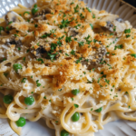Over-the-top portion of baked tuna tetrazzini with golden cheese and breadcrumbs