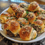 Phone photo of homemade garlic parmesan cheeseburger bombs with melted cheese