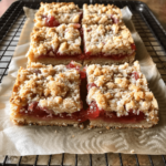 Overhead shot of jam crumb bars with buttery crumble topping