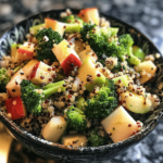 Broccoli apple quinoa salad with crisp apples and broccoli in a bowl