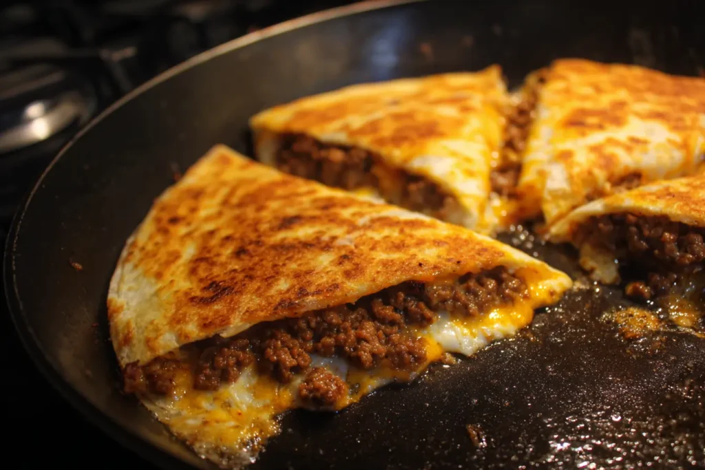 Browning and draining ground beef for sheet pan cheeseburger quesadilla filling