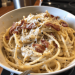 Creamy carbonara with bacon, parmesan, and black pepper