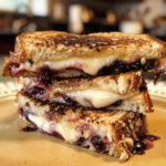 Crispy blueberry grilled cheese with melted brie and blueberry jam