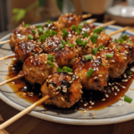 Japanese chicken meatball skewers (tsukune) glazed with sticky tare sauce