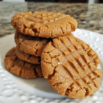 Keto peanut butter cookies stacked on a plate