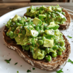 Smashed broad beans and avocado on toast on toasted sourdough