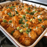 Chili cheese tater tot casserole with crispy golden tater tots and melted cheddar