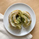 Single Matcha Custard and White Chocolate Roll showing the custard filling inside