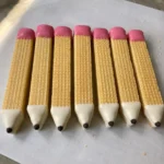 Close-up of Sugar Wafer Pencil Cookies lined up on parchment paper