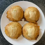 Close-up of Ghost Mini Taco Pies on a plate