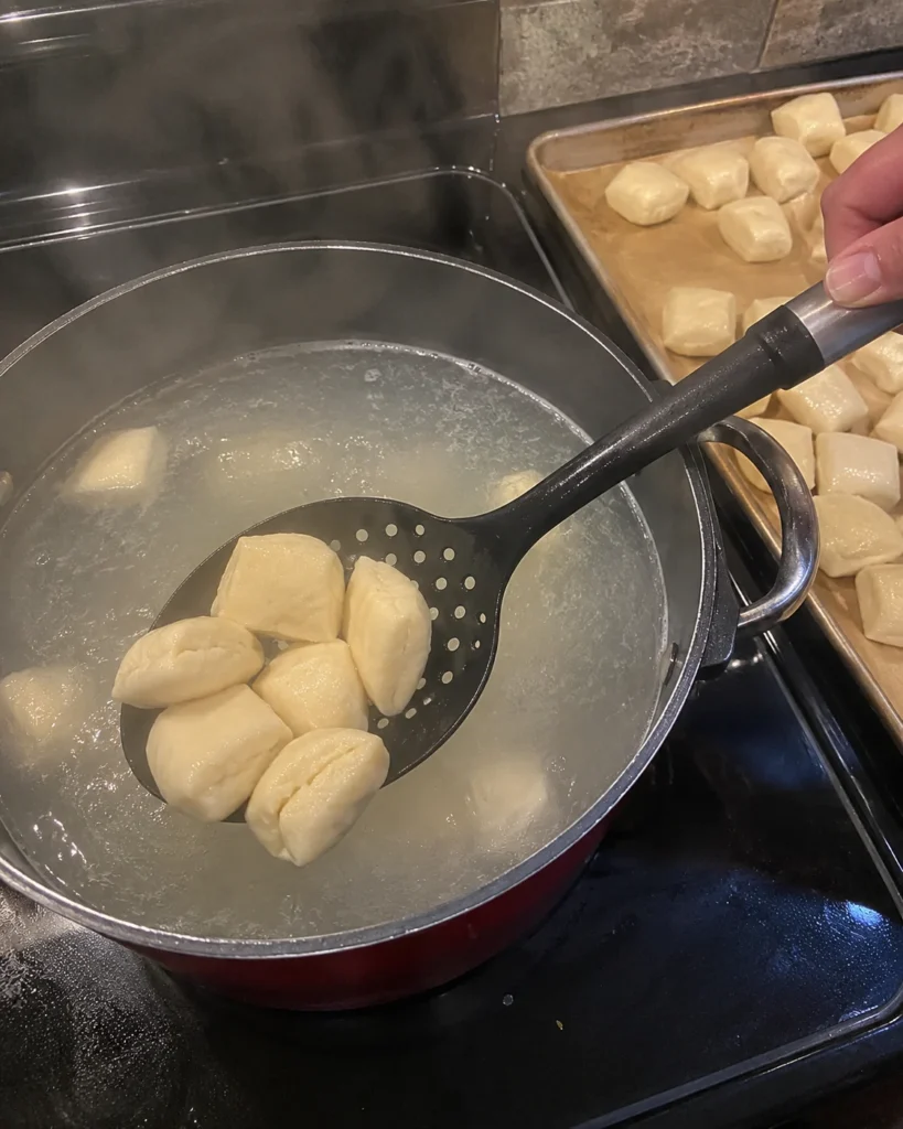 Boiling Homemade Soft Pretzel Bites in a baking soda water bath