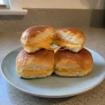 Mini grilled cheese for school sandwiches stacked with melted cheese pull