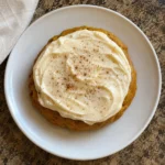 Close-up of Pumpkin Cookies with Cream Cheese Frosting on a small plate