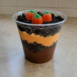 Close-up of a single Pumpkin Patch Dirt Cups serving with visible pudding layers