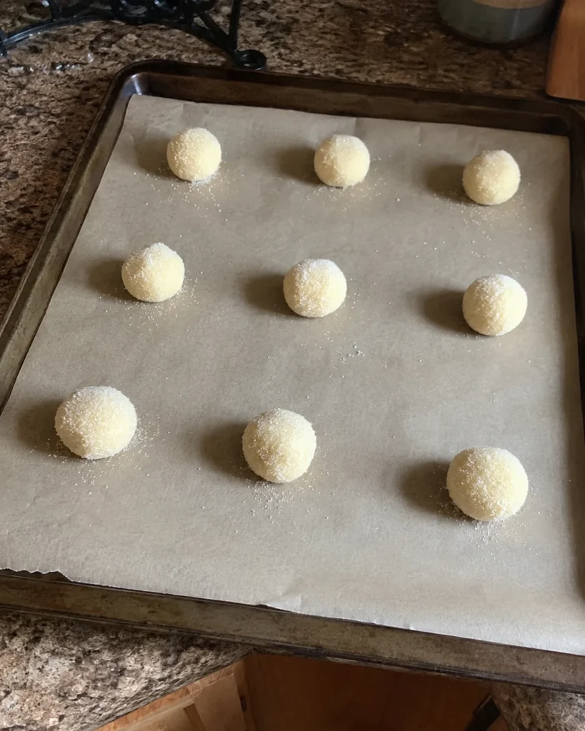 Almond Flour Cookies dough balls rolled in sugar before baking