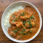 Close-up of Slow Cooker Indian Butter Chicken in a bowl with rice